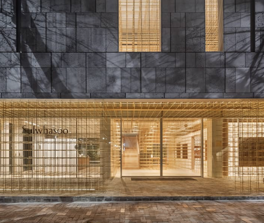 "Sulwhasoo flagship storefront with gold exterior showcasing luxury skincare branding"